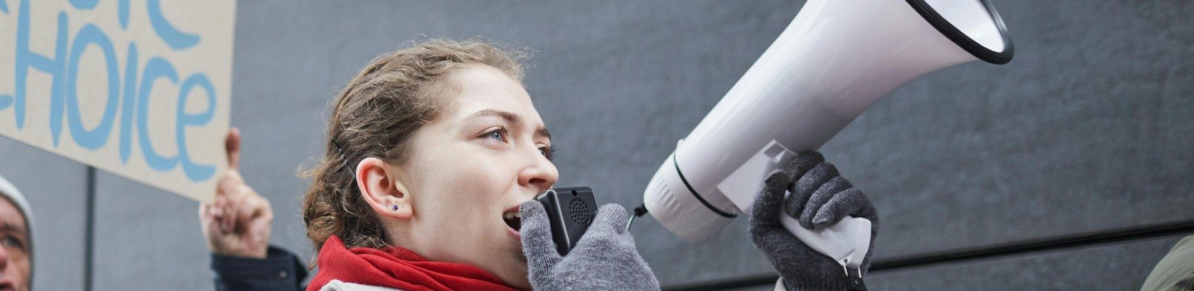 woman with megaphone protesting